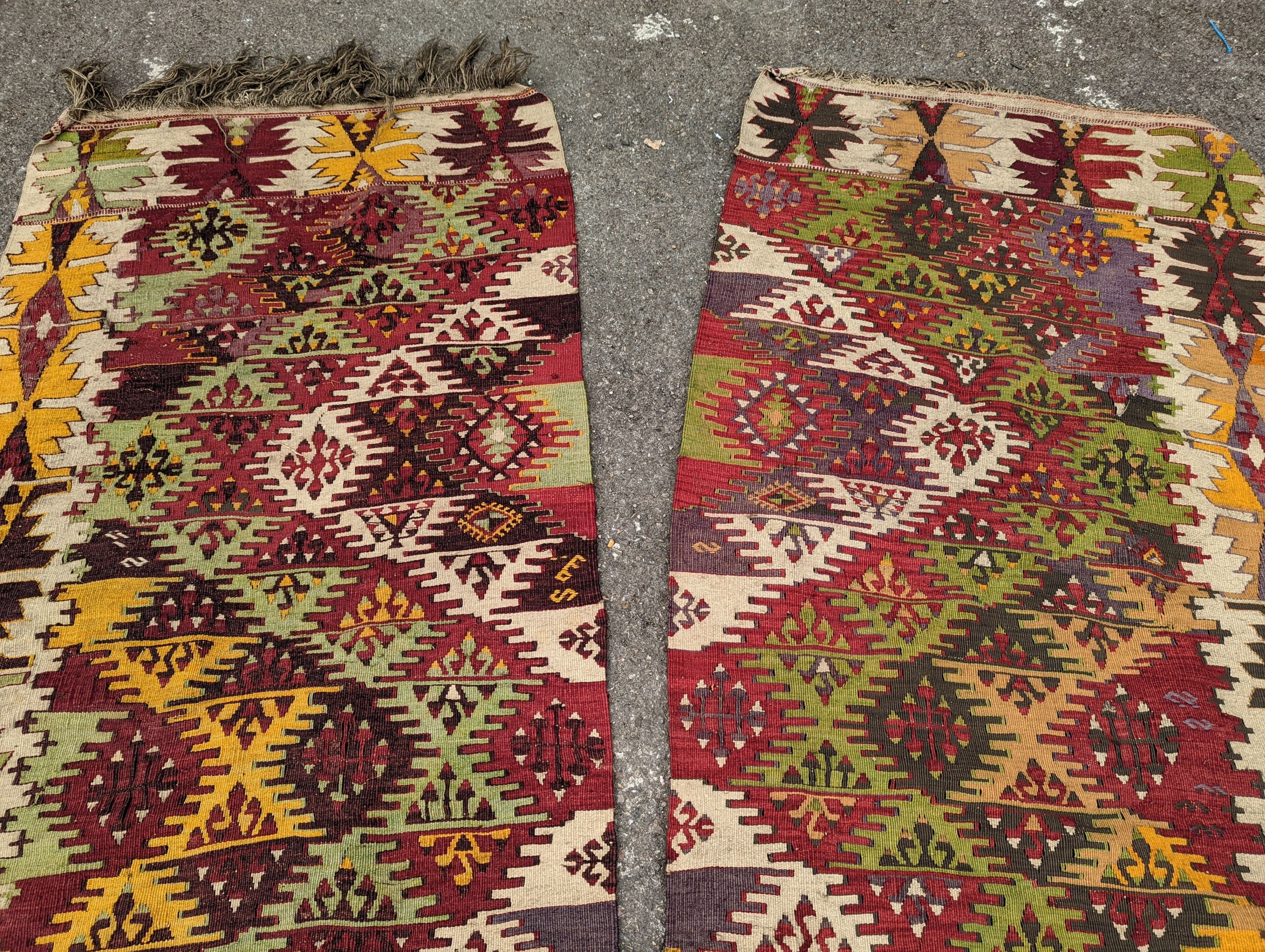 A Kelim polychrome flatweave carpet, cut centrally to create a pair of runners, each 410 x 85cm